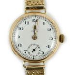 A lady's 1920's 9ct gold Omega manual wind wrist watch, on a later 9ct gold strap, overall 18.5cm,