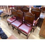A set of six 18th century style panelled oak dining chairs, two with arms