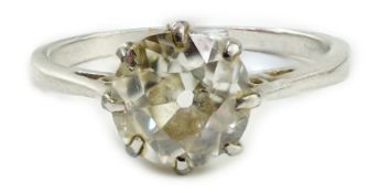 A white metal (stamped plat) and solitaire diamond ring, size J, gross weight 2.6 grams, the stone