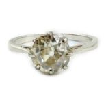 A white metal (stamped plat) and solitaire diamond ring, size J, gross weight 2.6 grams, the stone