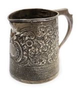 A George III silver mug, with later embossed decoration (af.), Charles Hougham?, London, 1812,