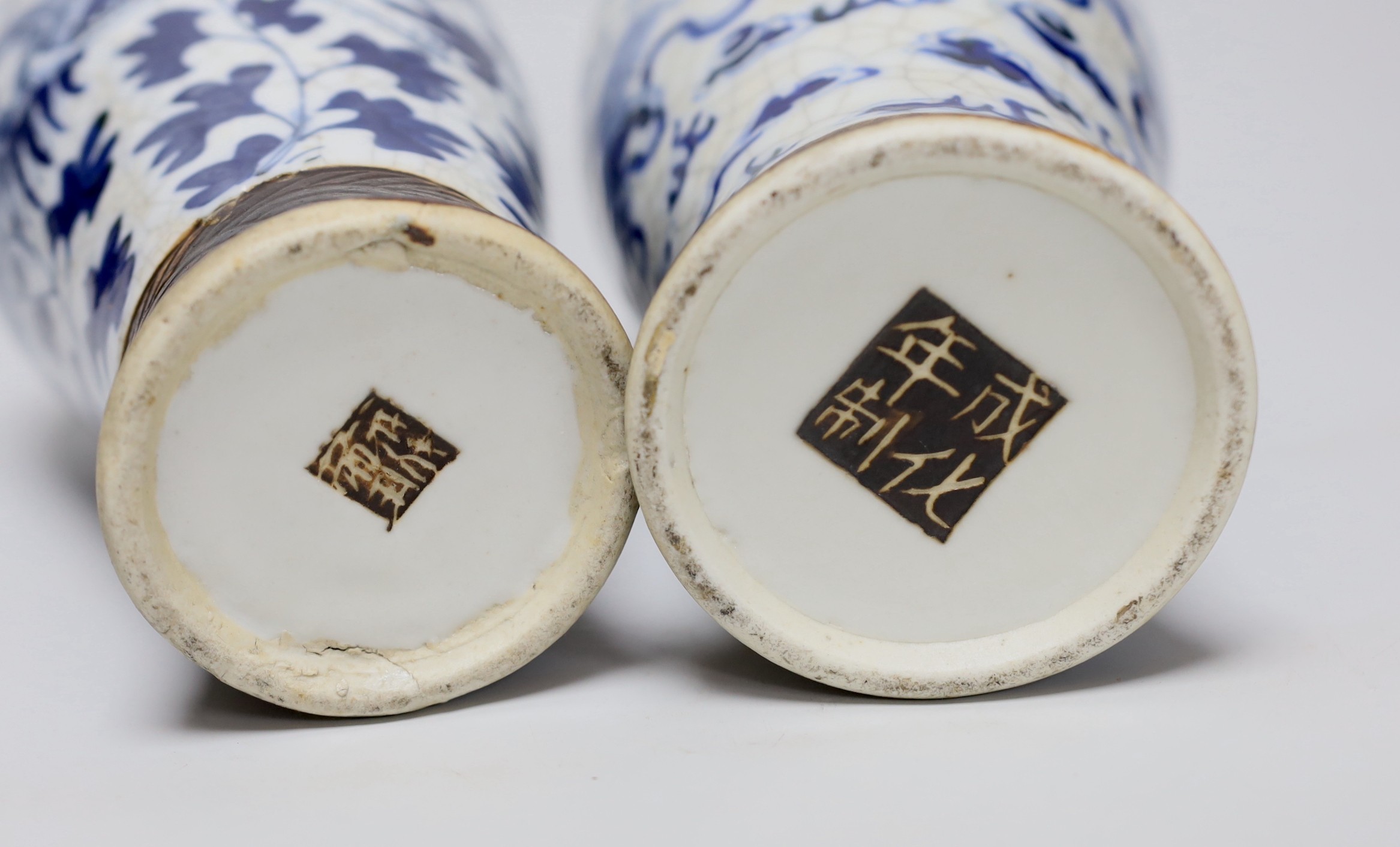 A pair of 19th century Chinese crackleglaze blue and white vases, 27cm - Image 4 of 4