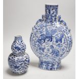 A Chinese blue and white moonflask and a similar double gourd vase, 19th century, moon flask 31cms