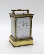 A large brass cased carriage clock retailed by St. James, 17cm