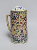 Jessie Marion King (1875-1949), a covered floral jug, 18.5cm