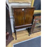 A George III style mahogany cabinet on stand, width 66cm, depth 41cm, height 129cm