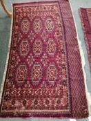 A Tekke burgundy ground rug, 148 x 86cm