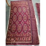 A Tekke burgundy ground rug, 148 x 86cm