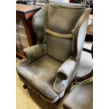 A Queen Anne revival upholstered wing armchair, width 71cm, depth 62cm, height 110cm