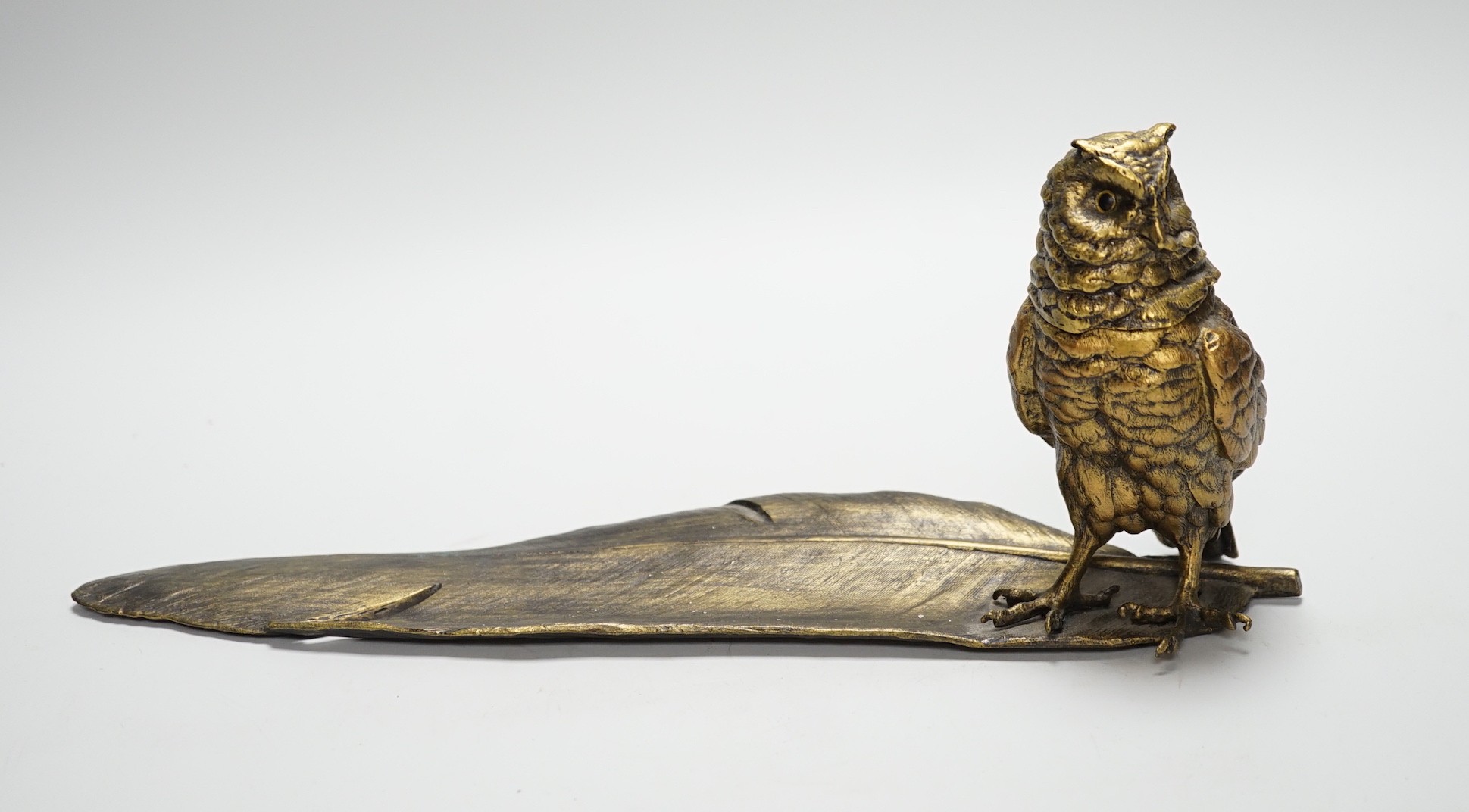 A bronze ‘owl and a feather’ inkwell with Bergman mark, 34cm long