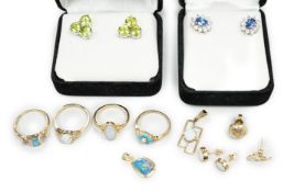 Four assorted modern 9ct gold and gem set rings including two white opal, gross weight 9.4 grams,