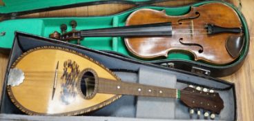 A late 19th century German violin together with an Italian mandolin, (both cased)