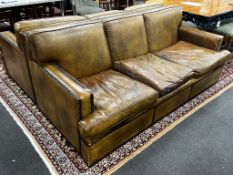 A pair of brown leather brass studded three seater settees, length 200cm, depth 90cm, height 84cm