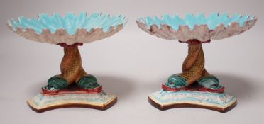 A pair of late 19th century Royal Worcester majolica dolphin comports, 10cm tall