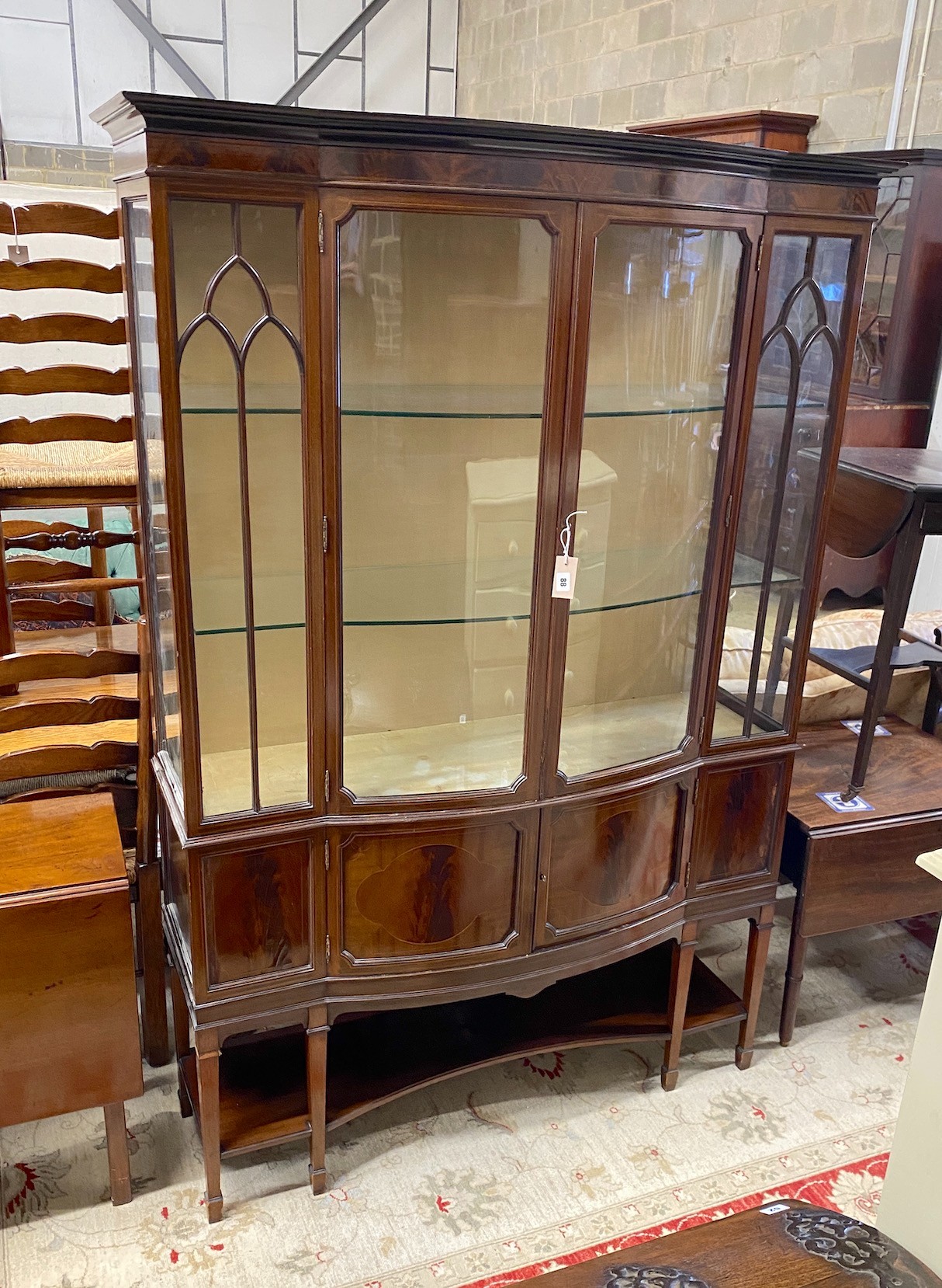 An Edwardian mahogany bow front display cabinet, width 126cm, depth 44cm, height 187cm