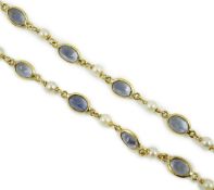 A modern 18ct gold, blue quartz and cultured pearl set spectacle necklace, 58cm, gross weight 15