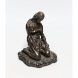 A cast resin figure of a kneeling classical figure, 13.5cms high