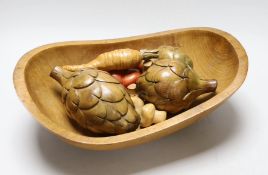 An Applewood bowl containing carved wooden fruit and vegetables, bowl 38cms wide
