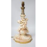 A large Royal Worcester blush ivory cherub lamp base, 40cms not including light fitting