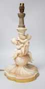 A large Royal Worcester blush ivory cherub lamp base, 40cms not including light fitting