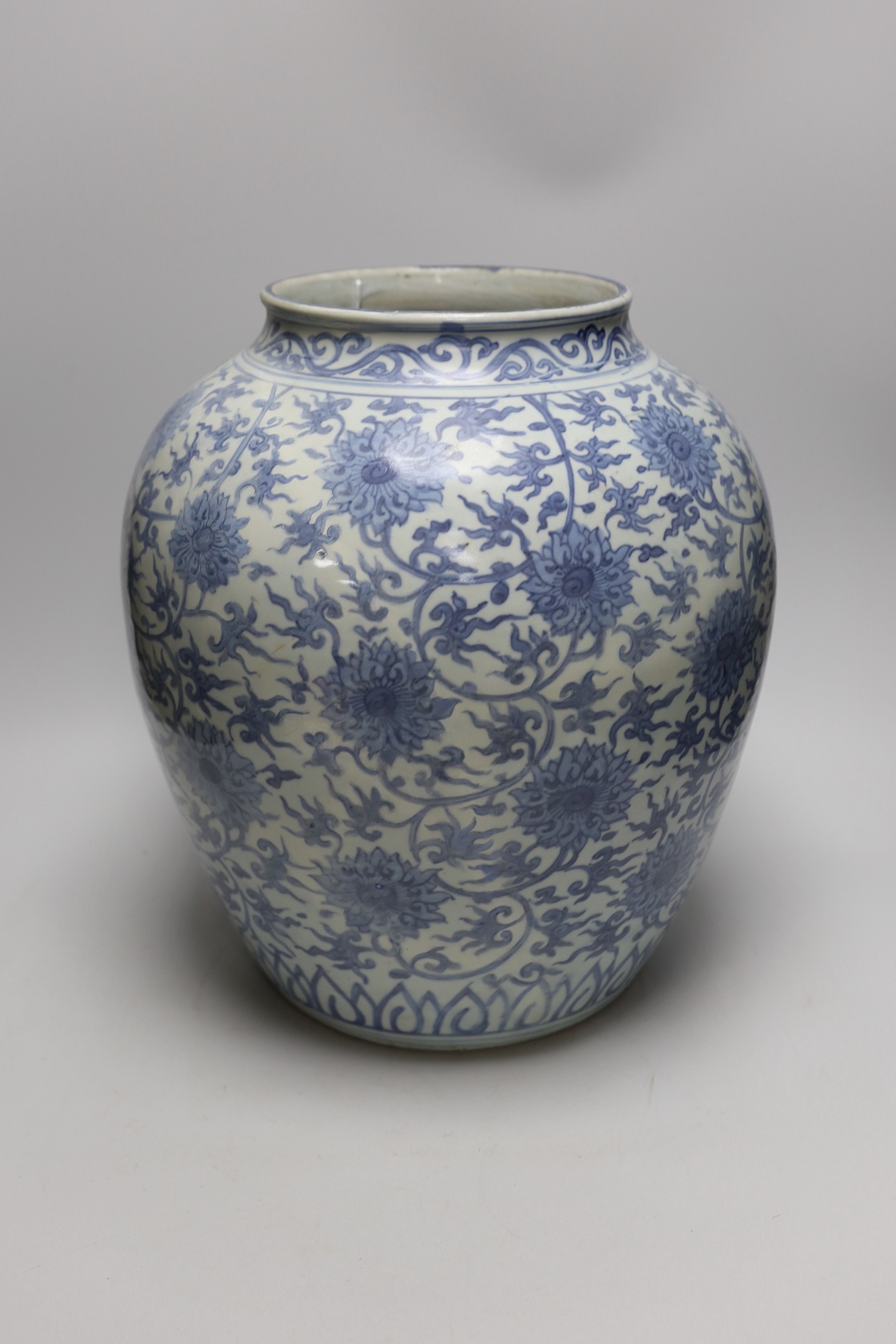 A Chinese blue and white 'lotus' jar, 17th century, 38cms high, restored - Image 2 of 4