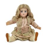 A Danel and Cie moulded bisque doll, French, 1891, impressed B6F with red check marks, closed mouth,