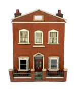 A back-opening furnished English dolls’ house, late 19th century, modelled as a double-fronted