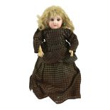 A Tete Jumeau bisque doll, French, circa 1885, stamped in red DEPOSE DEP JUMEAU BTE SGDG 3, with red