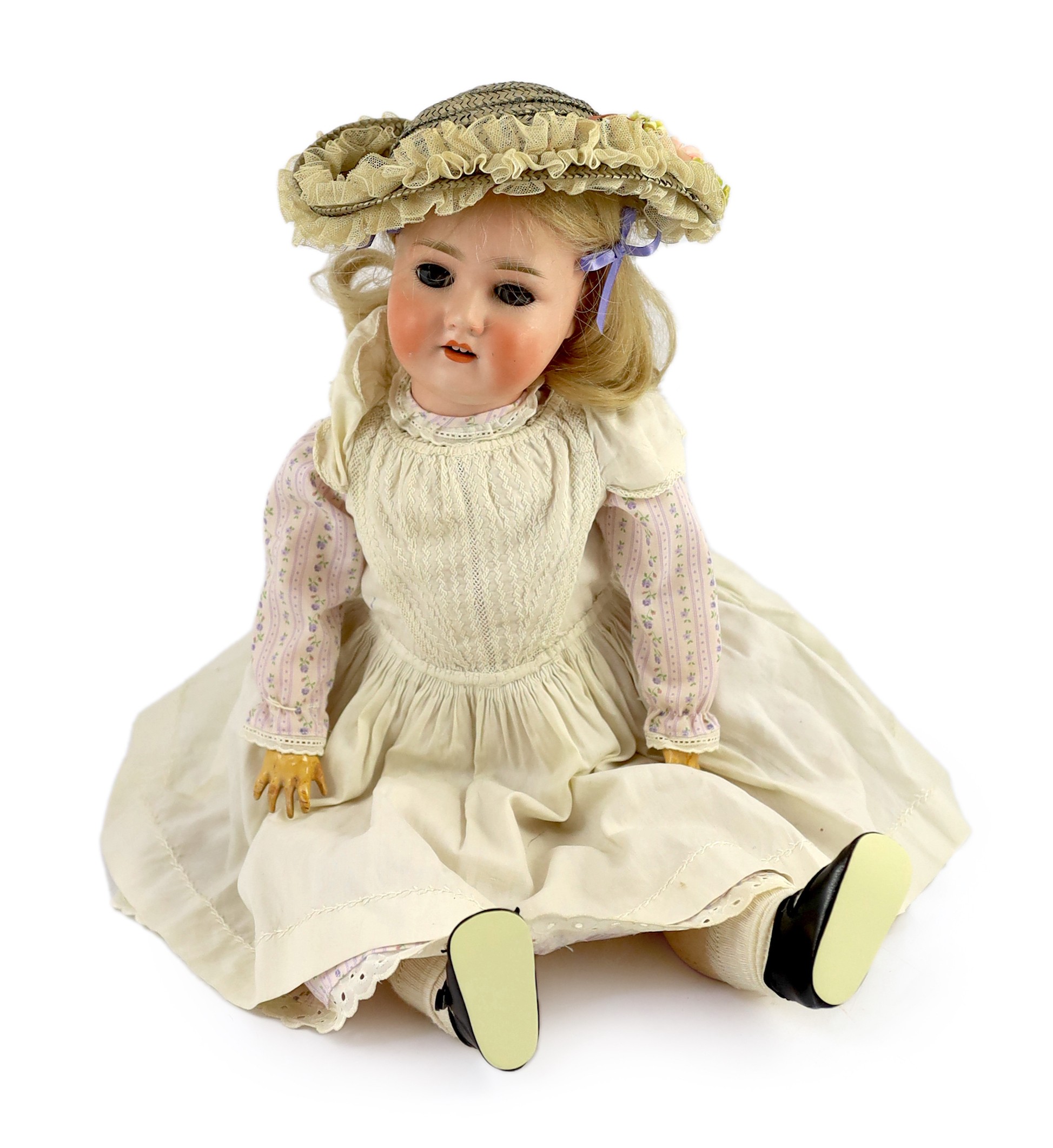 A Schoenau & Hoffmeister bisque doll, German, circa 1909, impressed 1909 7½, with open mouth and