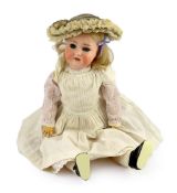 A Schoenau & Hoffmeister bisque doll, German, circa 1909, impressed 1909 7½, with open mouth and