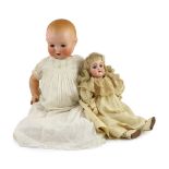 A Heinrich Handwerck bisque doll, German, circa 1900, impressed 79 10, with open mouth and upper