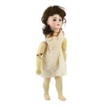 A Bru Jeune R bisque doll, French, circa 1890, impressed Bru Jne R 9, with open mouth and upper