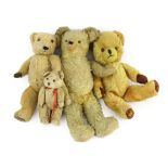 A blonde plush Teddy bear, glass eyes and shaved snout, 18in., and three other Teddy bears***