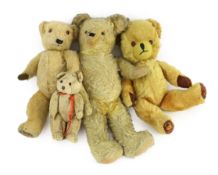 A blonde plush Teddy bear, glass eyes and shaved snout, 18in., and three other Teddy bears***