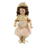 A rare Simon & Halbig walking kiss-blowing bisque doll, German, circa 1891, impressed 1039 Simon &