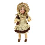 A J.D. Kestner bisque doll, German, circa 1905, impressed 174 8½, with open mouth and upper teeth,