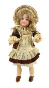 A J.D. Kestner bisque doll, German, circa 1905, impressed 174 8½, with open mouth and upper teeth,