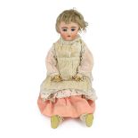 An Adolf Wislizenus bisque doll, German, circa 1910, impressed A.W. 11, with open mouth and upper