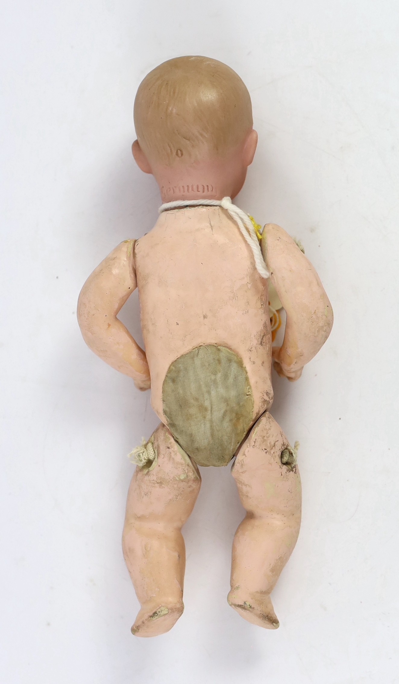 A Gebrüder Heubach bisque character boy doll, German, circa 1912, impressed 0, with closed pouty - Image 2 of 2
