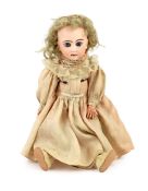 A Jumeau Bisque child doll, circa 1895, on a jointed composition body, with fixed blue eyes,