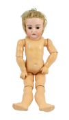 A J.D. Kestner bisque doll, German, circa 1910, impressed 192, with open mouth and upper teeth,