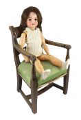 A bisque doll, German, circa 1900, impressed 70, with open mouth and upper teeth, weighted brown