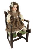 A German bisque doll, impressed W&S, 125-10, weighted glass eyes and open mouth, jointed wood and