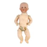 A Gebrüder Heubach bisque character boy doll, German, circa 1912, impressed 0, with closed pouty