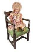 A Heubach Koppelsdorf bisque doll, German, circa 1914, impressed 250/5, with open mouth and upper
