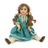 A Jumeau bisque doll, French, circa 1895, impressed 8, with open mouth and upper teeth, fixed blue