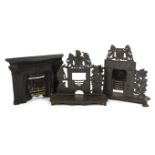 Three early 19th century cast iron model fire grates, two incorporating Royal Arms, largest 12in.