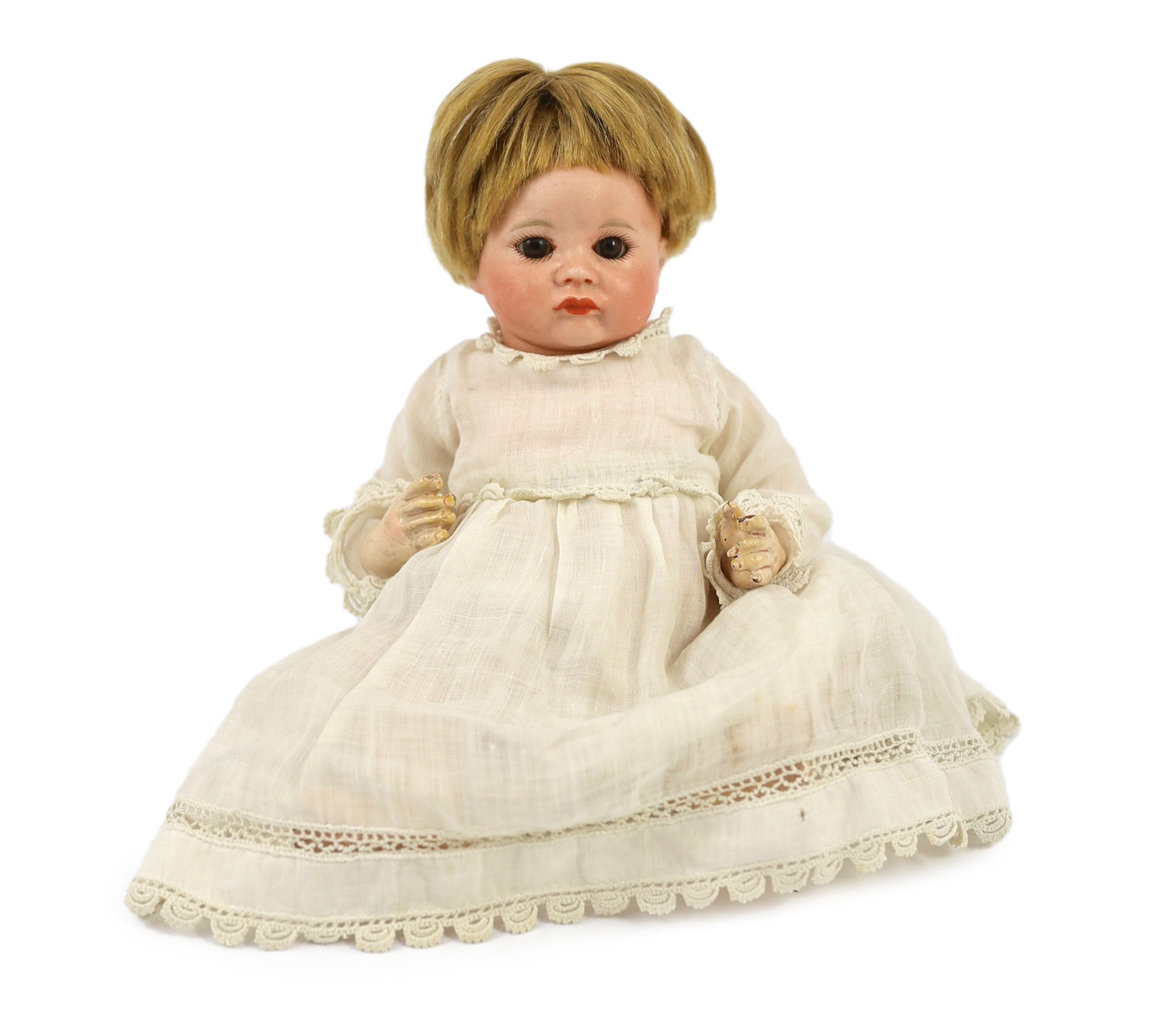 An SFBJ bisque character doll, French, circa 1925, impressed SFBJ 252, with closed pouty mouth,
