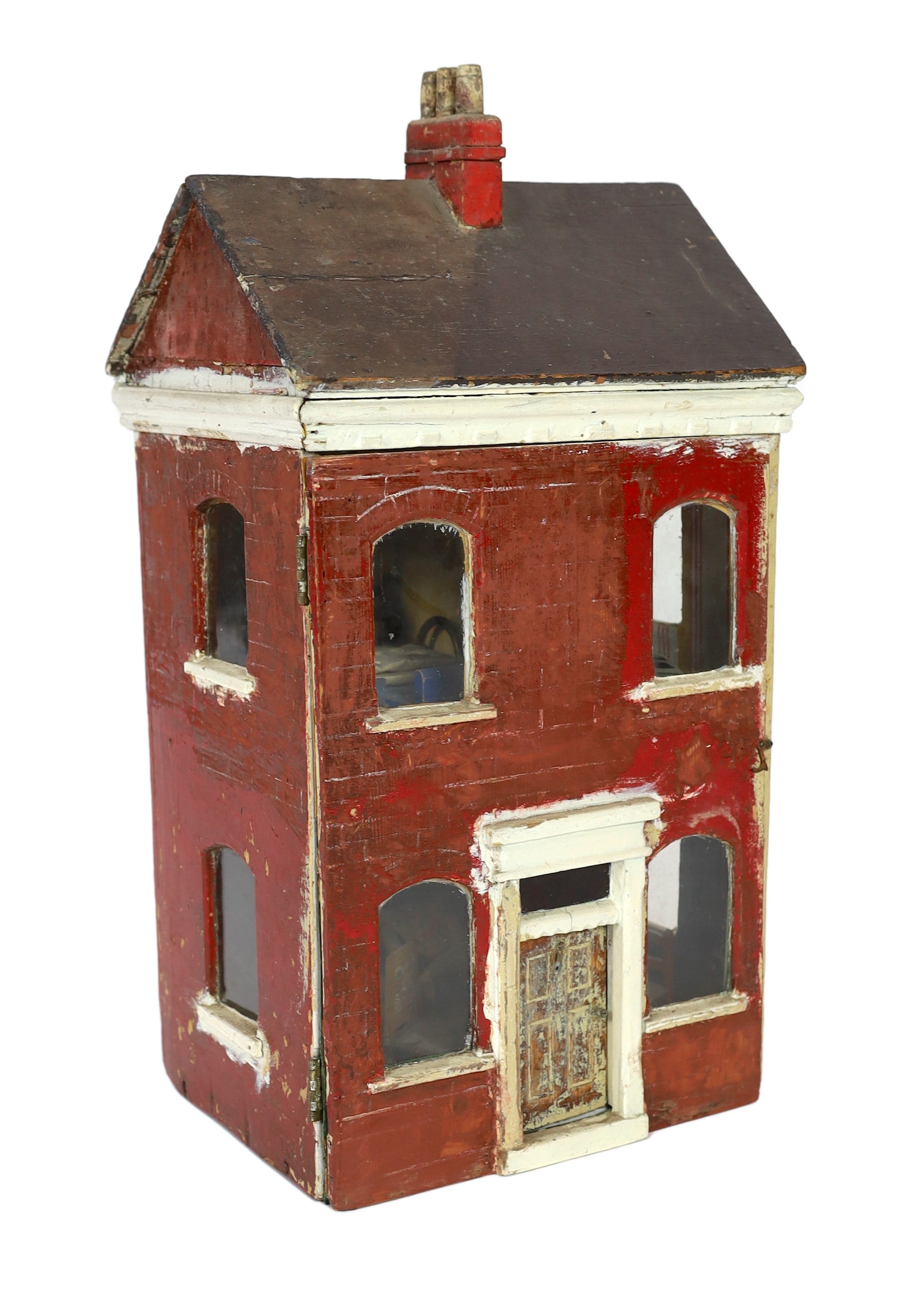 ‘Queens Lynn House’. A late 19th century home-made dolls' house, and contents