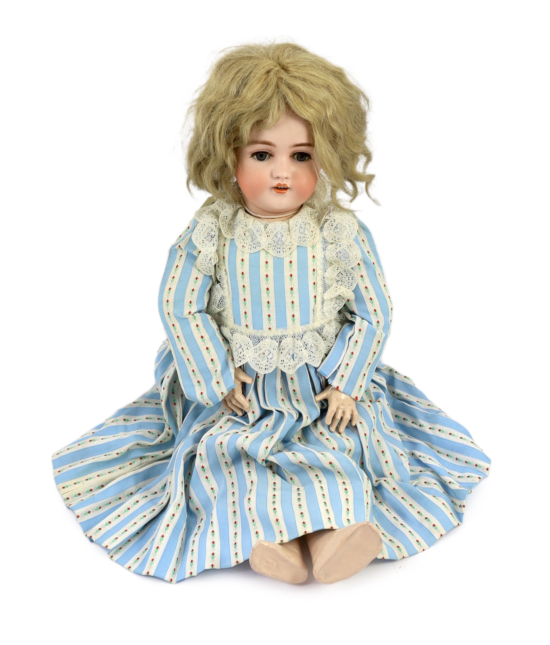 A Simon & Halbig bisque doll, German, circa 1892, impressed 1079 11½, with open mouth and moulded